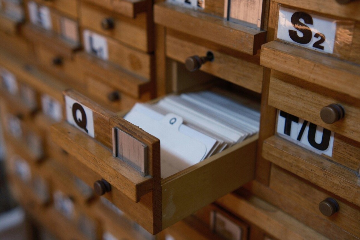 Wooden library card-catalog drawers, one pulled open